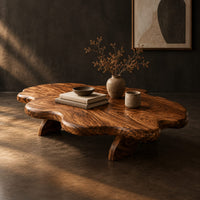 Cloud shaped coffee table with a thick wavy top and angled legs, three-quarter view showing the grain