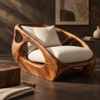 Corner detail of chunky wooden chair with swirling grain and oval cutouts in the sides beside wood, brass and linen samples