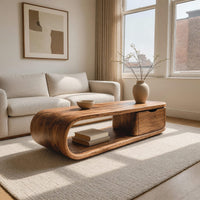 Long loop coffee table with a side drawer box in an open plan space in daylight