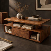 Corner detail of coffee table with a floating slab top and open end bays beside wood, brass and linen samples