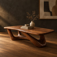 Coffee table with an irregular soft edged top on sculpted branching legs, three-quarter view showing the grain