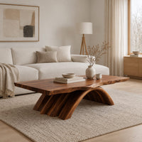 Coffee table with a natural edge top on a fanned arch base in a Scandinavian living room with white walls