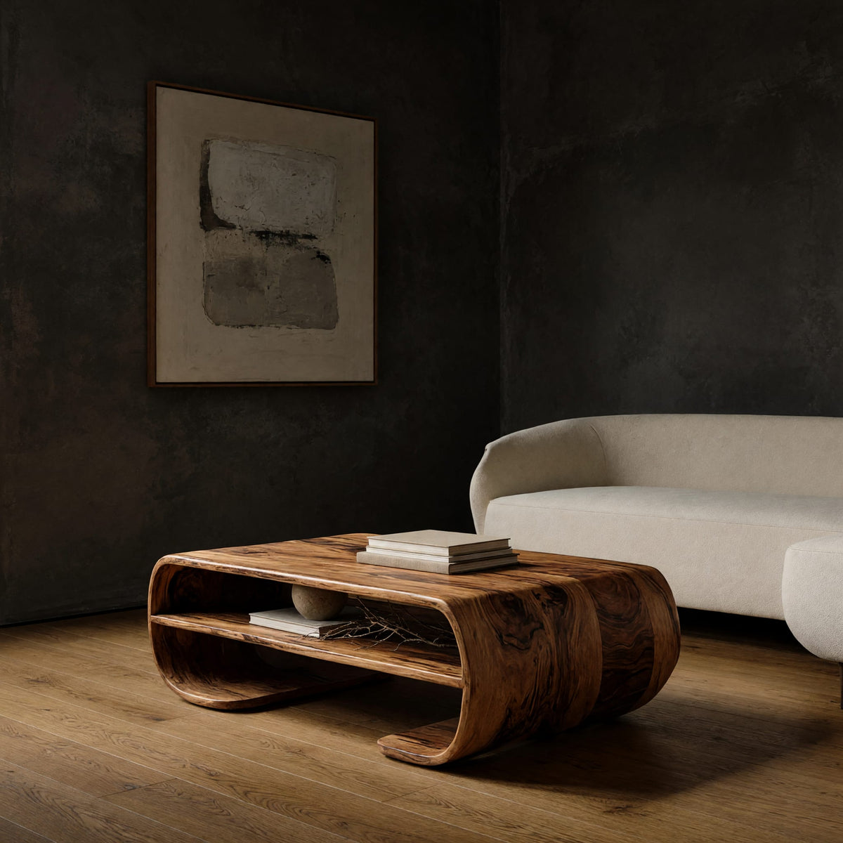 Coffee table with rolled ends and a double open shelf in a dark studio against a charcoal wall