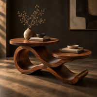 Wooden coffee table with two circular tops on a swooping ribbon base, three-quarter view showing the grain