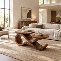 Wooden coffee table with two circular tops on a swooping ribbon base in a bright open plan living room