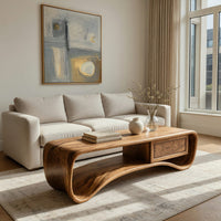 Compact loop coffee table with a small drawer in an open plan space in daylight