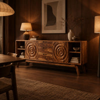 Sideboard with ring carved panels and open end shelves on angled legs in an evening dining room with walnut wall paneling