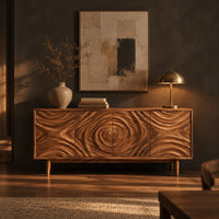 Wooden sideboard with four rippled relief doors on tapered legs in a dark dining room at golden hour