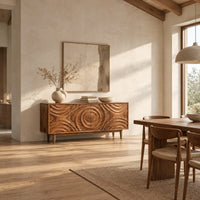 Wooden sideboard with four rippled relief doors on tapered legs in a bright open plan dining room