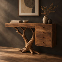 Corner detail of console table on a branching trunk base with a four drawer block beside wood, brass and linen samples