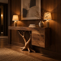 Console table on a branching trunk base with a four drawer block in an evening entryway with walnut wall paneling
