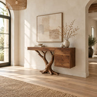 Console table on a branching trunk base with a four drawer block in a bright open plan entryway