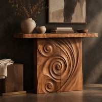 Corner detail of console table with a spiral carved front and a slab top beside wood, brass and linen samples