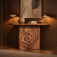 Console table with a spiral carved front and a slab top in an evening entryway with walnut wall paneling