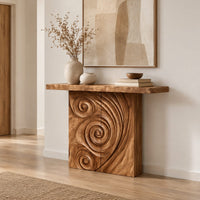 Console table with a spiral carved front and a slab top in a Scandinavian entryway with white walls