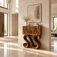 Wavy fluted console table on two large s shaped scroll legs in a bright open plan entryway