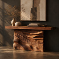 Console table with a solid block base carved in dune ripples, three-quarter view showing the grain