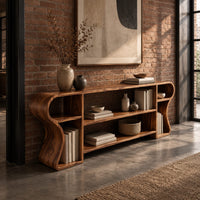Open shelf console table with wavy curved ends and a divided center bay in an industrial loft entryway with exposed brick