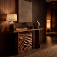 Console table with plank legs and a dune carved panel in an evening entryway with walnut wall paneling