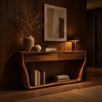Console table with flared sculpted sides, a low shelf and two drawers in an evening entryway with walnut wall paneling