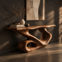 Narrow console table with a flowing s shaped base and an open loop foot, three-quarter view showing the grain