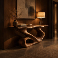 Narrow console table with a flowing s shaped base and an open loop foot in an evening entryway with walnut wall paneling