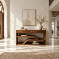 Console table with a flowing wave shelf inside an open wood frame in a bright open plan entryway