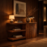 Console table with open shelves and a two door cabinet in an evening entryway with walnut wall paneling