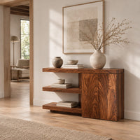 Console table with open shelves and a two door cabinet in a Scandinavian entryway with white walls