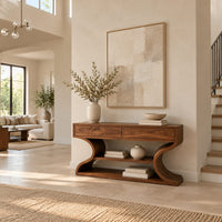 Console table with s shaped side supports and a lower shelf in a bright open plan entryway