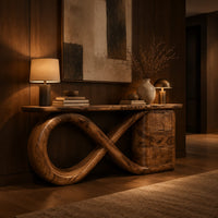Console table with an infinity loop base and a stacked block at one end in an evening entryway with walnut wall paneling