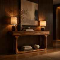 Console table with a thick top and an open loop frame base in an evening entryway with walnut wall paneling