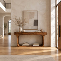 Console table with a thick top and an open loop frame base in a bright open plan entryway