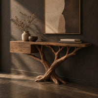 Console table with a twisting branch base and a drawer unit at one end, three-quarter view showing the grain