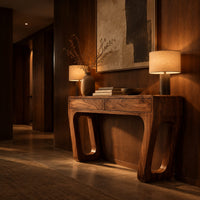 Console table with a two panel front and angled legs with oblong slots in an evening entryway with walnut wall paneling