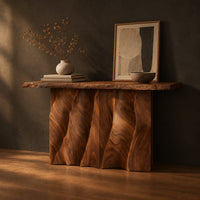 Console table with a wave carved fluted base and a live edge top, three-quarter view showing the grain