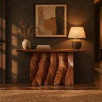 Console table with a wave carved fluted base and a live edge top in a dark entryway at golden hour