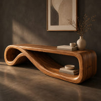 Corner detail of low tv stand formed from one curling ribbon of wood beside wood, brass and linen samples