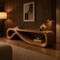Low tv stand formed from one curling ribbon of wood in an evening living room with walnut wall paneling