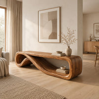 Low tv stand formed from one curling ribbon of wood in a Scandinavian living room with white walls