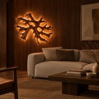 Coral shaped branching wall light with a warm halo of glow behind it in an evening living room with walnut wall paneling