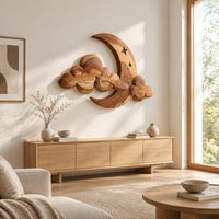 Crescent moon and layered cloud wall art with two small stars above a light oak sideboard in daylight