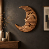 Detail of crescent moon wooden wall art with two carved stars and layered waves beside wood, brass and linen samples