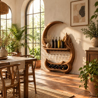 Crescent moon wine rack with a carved peak, a shelf and a glass rail in a bright dining room with arched windows and plants