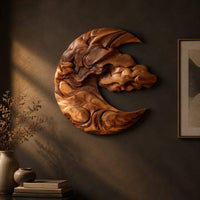 Crescent shaped wooden wall art carved with layered clouds and waves on a dark charcoal plaster wall