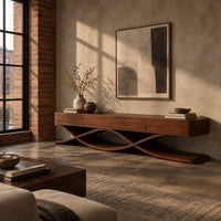 Long low tv stand with three front panels on crossing ribbon legs in an industrial loft living room with exposed brick