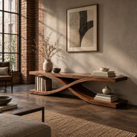 Low open tv stand with curved ribbons crossing in an x shape in an industrial loft living room with exposed brick