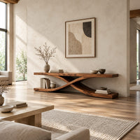 Low open tv stand with curved ribbons crossing in an x shape in a bright open plan living room