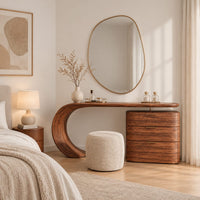 Makeup vanity with a sweeping curved leg and a block of three drawers in a Scandinavian bedroom with white walls