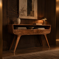 Curved console table with two drawers, open shelf and tapered legs in an evening entryway with walnut wall paneling